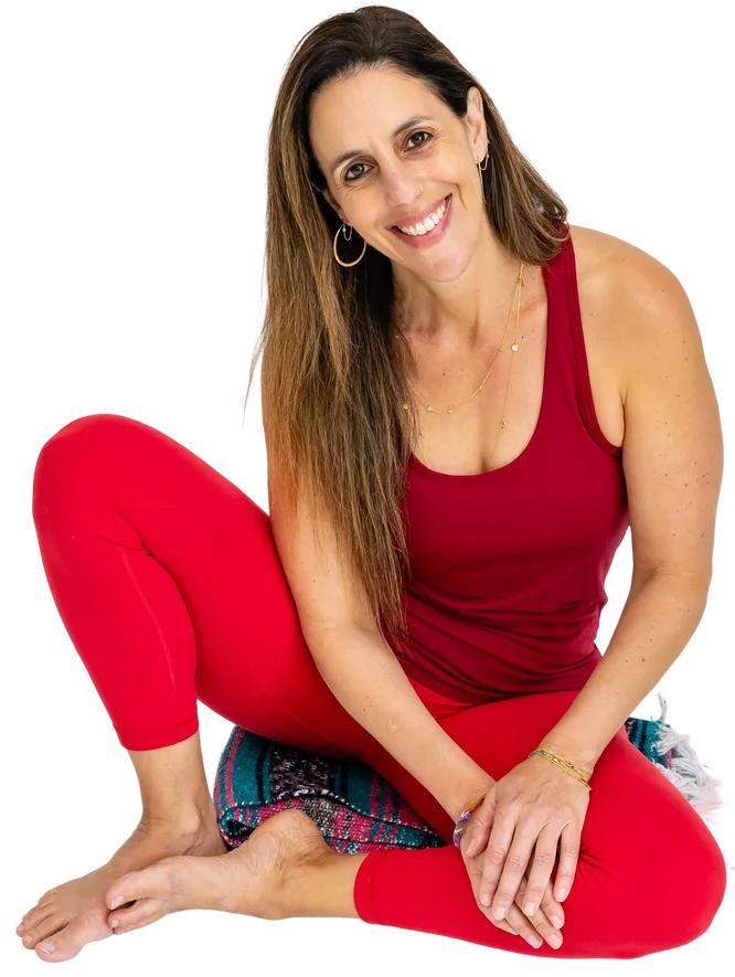 Lauren Ohayon seated cross-legged in red