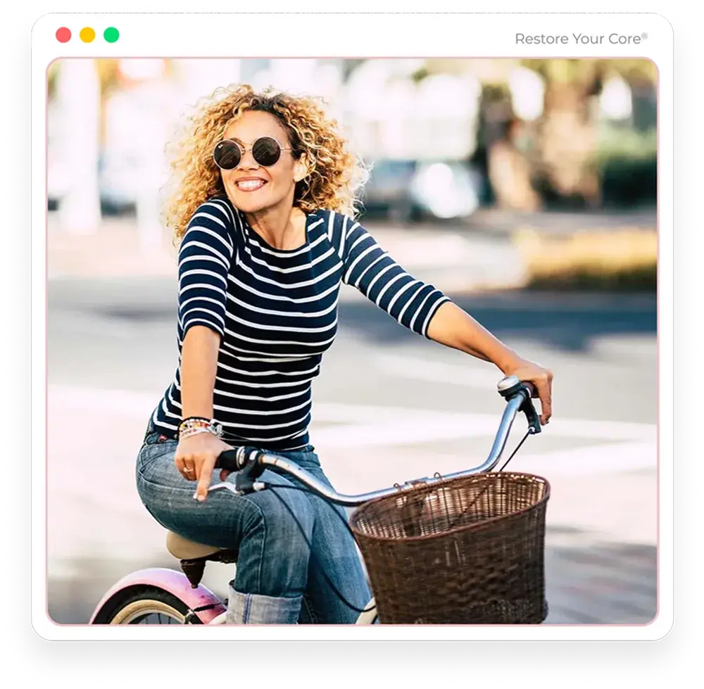 A woman riding a bicycle outdoors